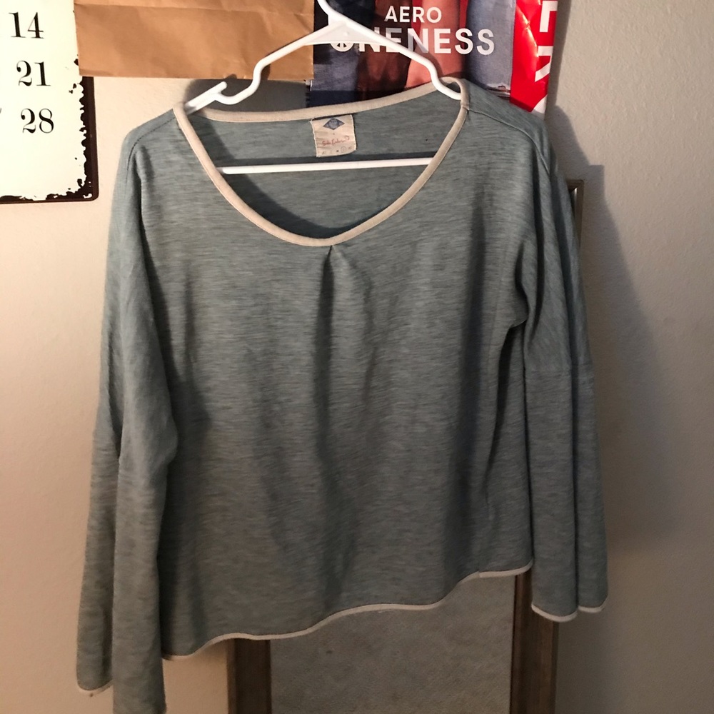 A vintage off the shoulder shirt